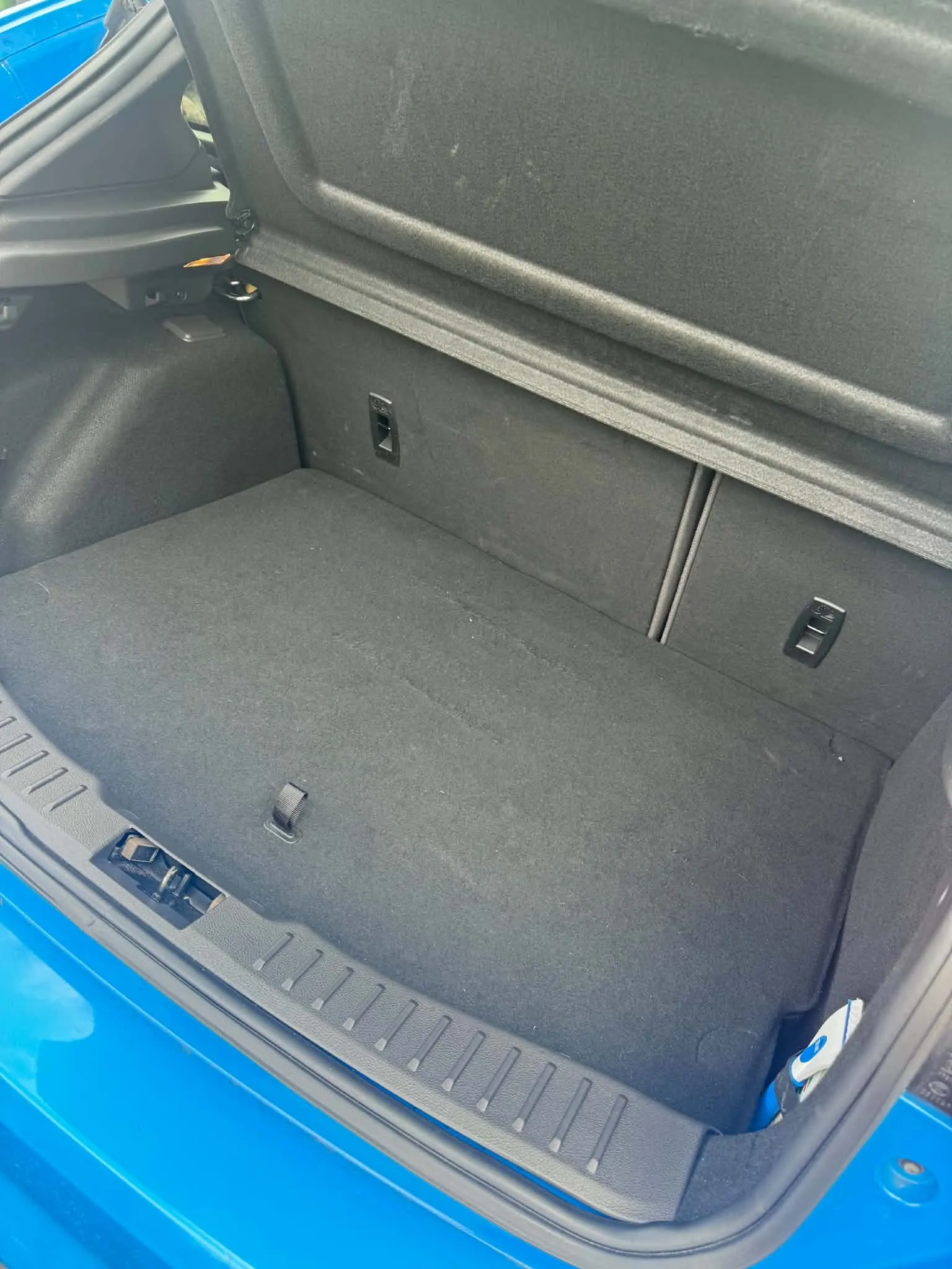 Deep cleaned boot carpet of a Ford Focus RS showing restored pile