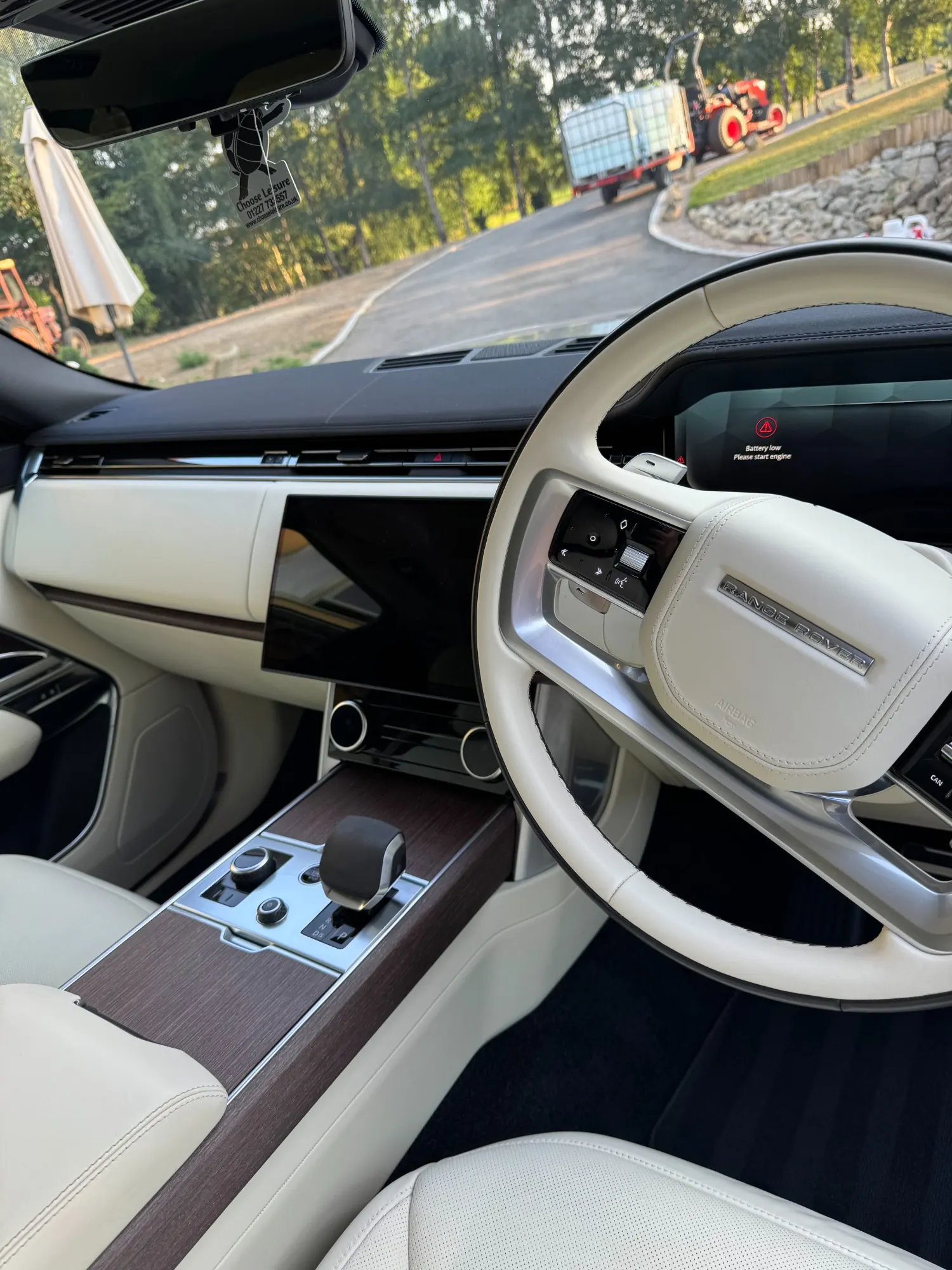 Cream and wood interior of a Range Rover after a premium interior detail