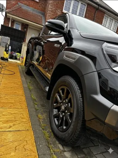 Silver pickup truck with black alloys after a full exterior detail